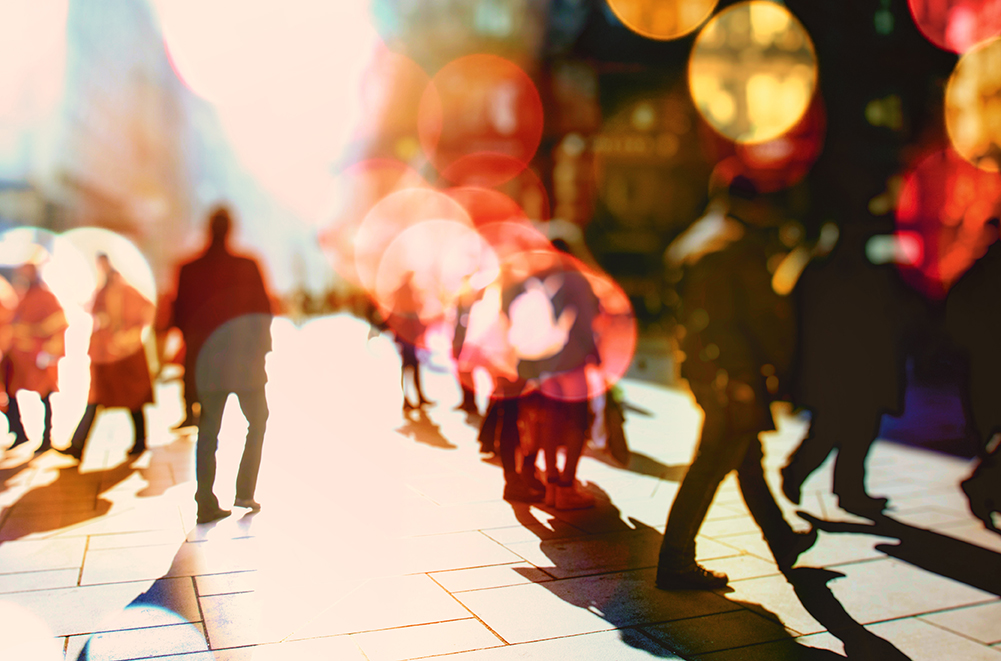 blurred image of people walking on street