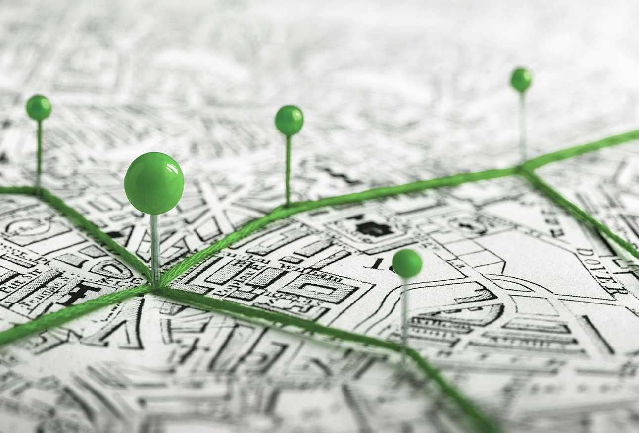 image of a map with green location pins